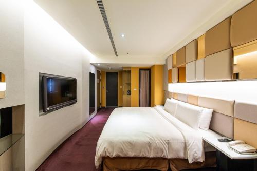 Ένα ή περισσότερα κρεβάτια σε δωμάτιο στο Hotel G7 Taipei