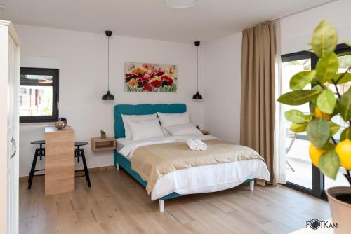Ένα ή περισσότερα κρεβάτια σε δωμάτιο στο Libar Studio Apartments