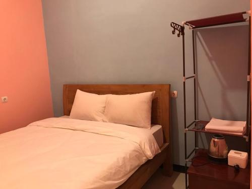 Ein Bett oder Betten in einem Zimmer der Unterkunft RoomZ Budget Residence