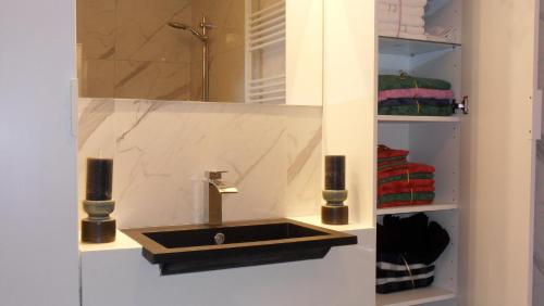 a bathroom with a sink and a mirror at Ambiance in Zierikzee