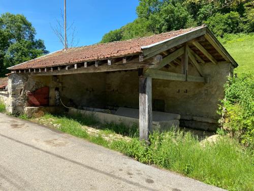 an old building on the side of a road at MIDORI in Saint-Rambert-en-Bugey