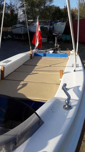 two boats are docked in a marina at Seehütte Neusiedlersee - Pfahlbau Waterfront 1 in Rust