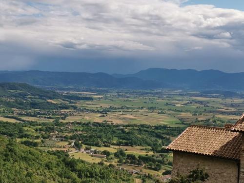 a view of a valley from a building at Il Torrione in Poggio Bustone
