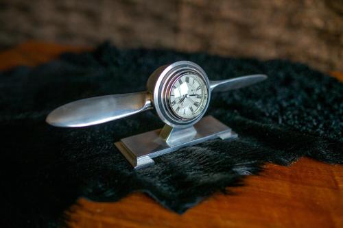 a silver watch sitting on top of a table at Green & Breakfast in Niederpallen