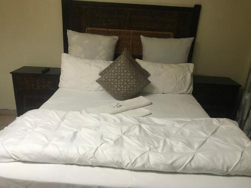 Ένα ή περισσότερα κρεβάτια σε δωμάτιο στο Kaste Guesthouse Secunda