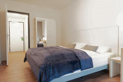 Tempat tidur dalam kamar di Gästehaus Hansa Residence