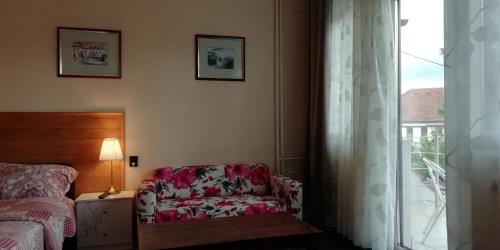 Uma cama ou camas num quarto em Árpád-ház Apartmanok