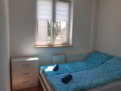 Postel nebo postele na pokoji v ubytování Mieszkanie przy Westerplatte