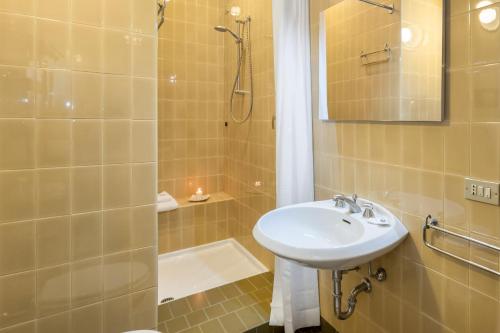 a bathroom with a sink and a shower at Castle View Room in Verona