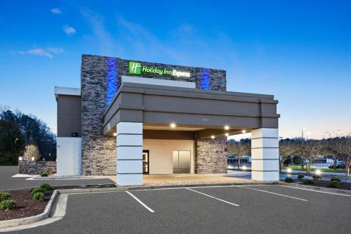 a building with a sign on top of it at Holiday Inn Express Hopewell - Fort Lee Area by IHG in Hopewell