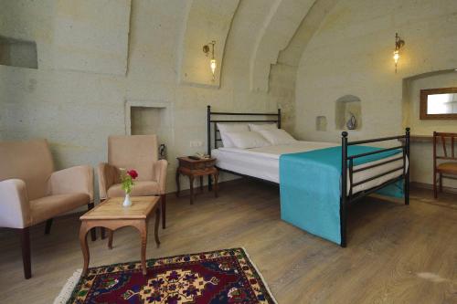 Ένα ή περισσότερα κρεβάτια σε δωμάτιο στο Jacob's Cave Suites - Cappadocia