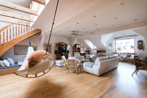 a living room with a hammock hanging from the ceiling at Apartment Neratovice in Neratovice