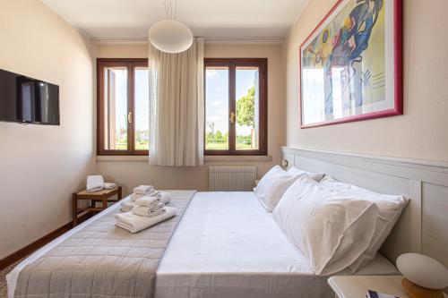 Katil atau katil-katil dalam bilik di Borgo Tabari Locazione Turistica