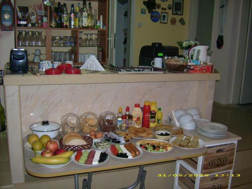 a table with many different types of food on it at Hotel Pasians in Pomorie