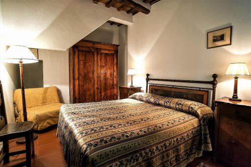 Hotel Santa Caterina tesisinde bir odada yatak veya yataklar