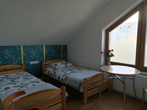 Katil atau katil-katil dalam bilik di Suwałki Centrum Apartament