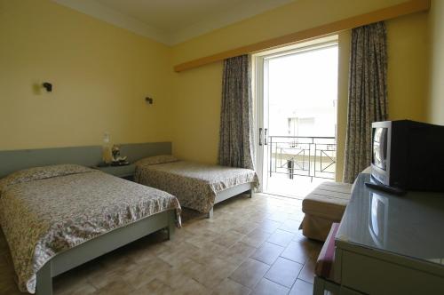 Postel nebo postele na pokoji v ubytování Ilis Hotel