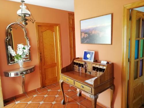a room with a table with bottles of wine at Casa Cabo de Gata in Retamar