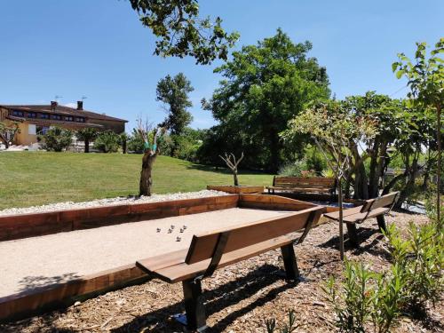 a picnic table with ducks on it in a park at Le gîte du Moulin in Lagardelle-sur-Lèze