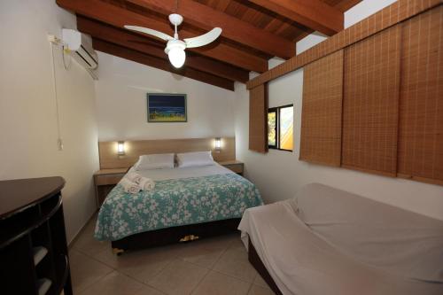 Cama ou camas em um quarto em Pousada Hibisco