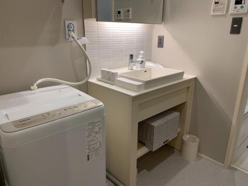 Ванная комната в GRAND BASE Nagoya Ekinishi