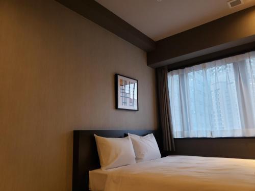 Letto o letti in una camera di Welina Hotel Premier Nakanoshima EAST