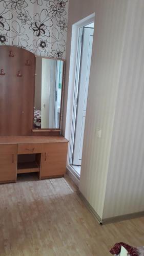 a dressing room with a mirror and a wooden desk at Tamuna Guest House in Martvili