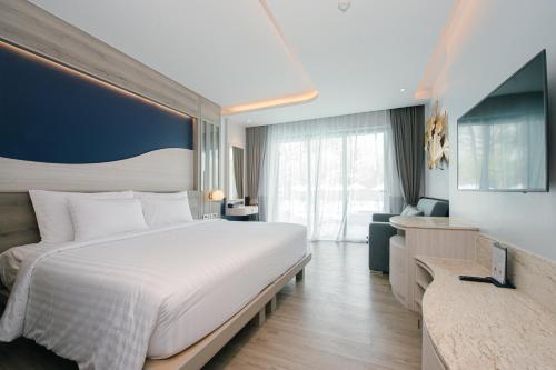 Ένα ή περισσότερα κρεβάτια σε δωμάτιο στο Seabed Grand Hotel Phuket - SHA Extra Plus