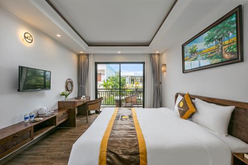 Postel nebo postele na pokoji v ubytování Villa Blake Hoi An