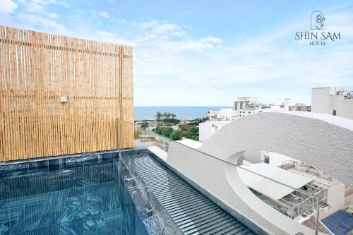 a swimming pool on the roof of a building at Shin Sam Boutique Hotel in Vung Tau