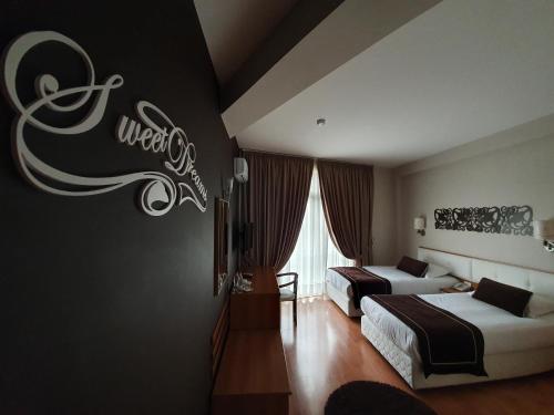 מיטה או מיטות בחדר ב-Hotel Arvi