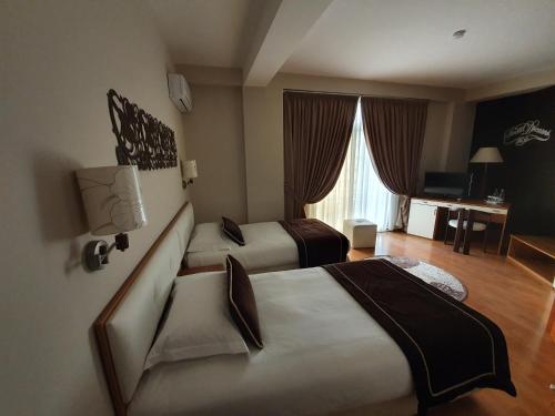 מיטה או מיטות בחדר ב-Hotel Arvi