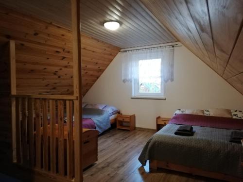 Postel nebo postele na pokoji v ubytování Miodunka
