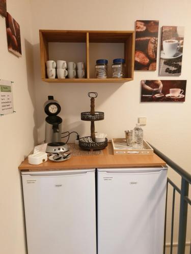 a kitchen with a counter with a coffee maker on it at Pension Boitz in Rust