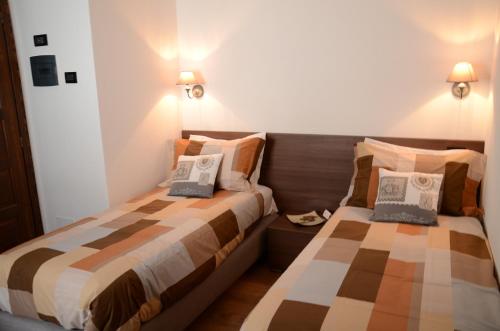 Postel nebo postele na pokoji v ubytování Maison Constance