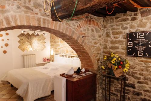 Postel nebo postele na pokoji v ubytování B&B Borgo di Oliveto - Appartamenti con Cucina