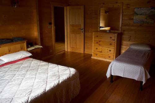 A bed or beds in a room at CHALET MONT AVIC