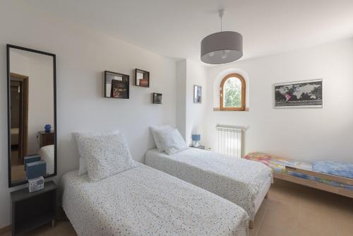 Katil atau katil-katil dalam bilik di La Flassantine - Appartement