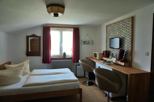 Ένα ή περισσότερα κρεβάτια σε δωμάτιο στο Hotel Garni Liberia