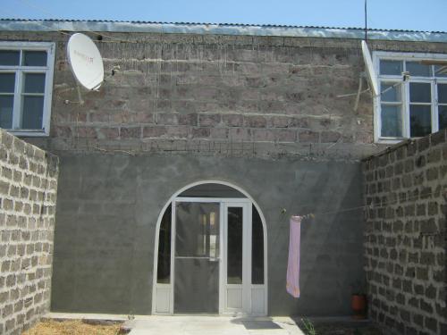 a brick building with a door and a window at Vacation Home in Ashtarak in Ashtarak