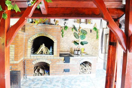 a brick oven with a pizza inside of it at Casa Pedro in Blăjani