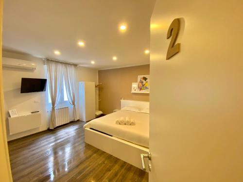 Katil atau katil-katil dalam bilik di Mimì Rooms&Studios