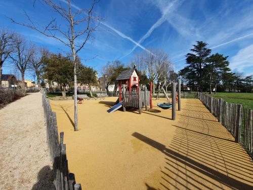 a playground in a park with a play structure at GITE LES ARCHES in Saint-Andéol-le-Château