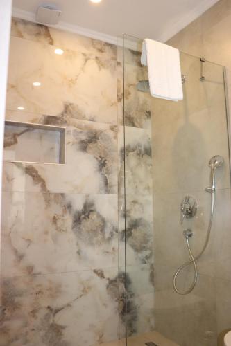 a bathroom with a shower with a glass at Zest Exclusive Hotel & Spa in Ortakent
