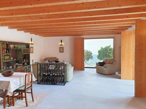 a large living room with a table and chairs at Casa das Hortênsias in Alijó