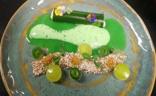 a plate with a letter c on it with grapes at Romantik Alpenhotel Waxenstein in Grainau