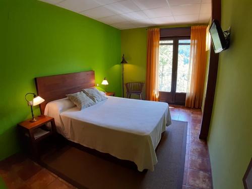 Katil atau katil-katil dalam bilik di Hotel Rural Los Molinillos