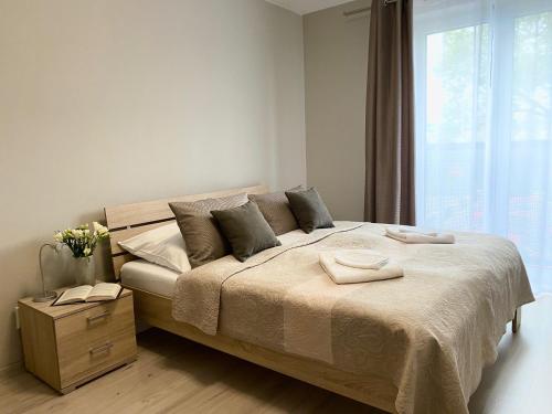 
Posteľ alebo postele v izbe v ubytovaní City Apartments
