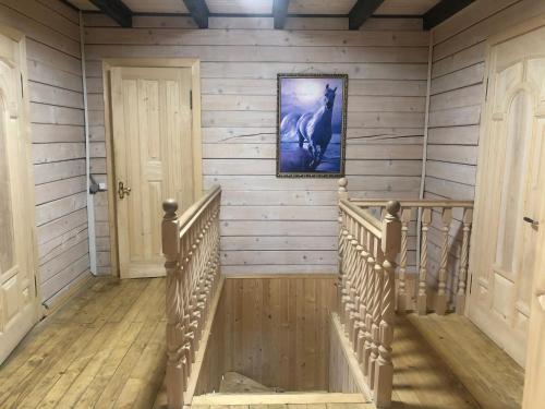 a staircase in a house with a picture on the wall at RIVIERA in Lekechi
