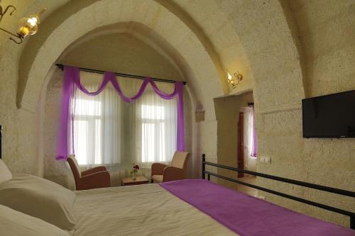 Μια τηλεόραση ή/και κέντρο ψυχαγωγίας στο Jacob's Cave Suites - Cappadocia